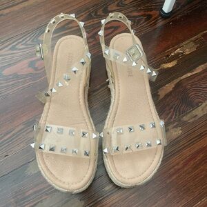 Studded Transparent Sandals with visible wear and tear
